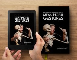 A woman holds a full-size human skeleton model in her arms, meeting its gaze with puckered lips in an expressive, playful gesture. She wears a black shirt and is framed against a solid black background. Her body and the skeleton mirror each other, suggesting a dialogue between life and anatomical structure. The image appears on both a tablet and a hardcover book placed on a wooden surface, emphasizing the book's physical and digital presence.