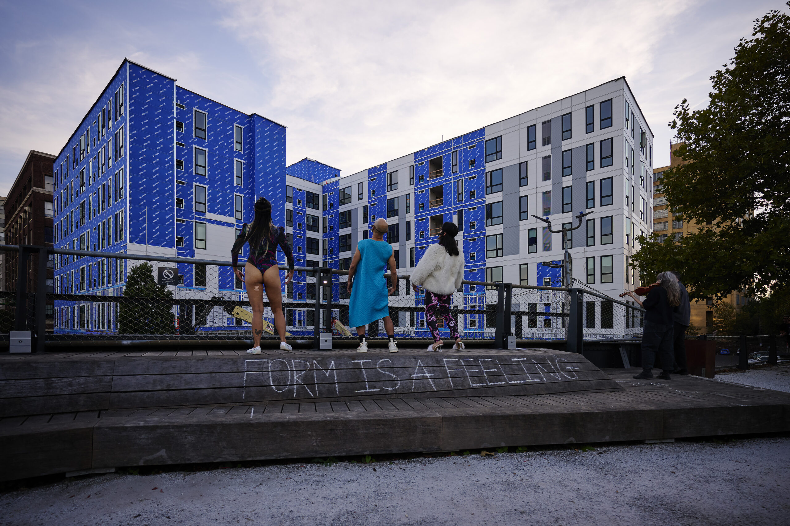 A performance of Anh Vo: Possessed by… at The Rail Park. The work takes the form of a devotional dance to the spirits, continuing a performance Vo previously staged on June 14, 2025, in front of the Apple Store in Downtown Brooklyn. There, the artist worshipped the temple of capitalism, drawing out the religiosity embedded in the store's architecture. In this iteration, Vo applies a similar logic: animating the site through repetitive, abstract movement to explore how architecture can embody systems of belief.