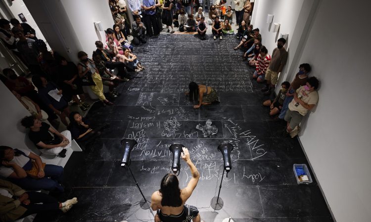 Asian Arts Initiative is proud to present Anh Vo: Punish, Perform, Possess, the artist's first-ever gallery exhibition. Vo is a Brooklyn-based, Vietnamese performance artist, choreographer, writer, and activist. Structured as a sustained performance, Punish, Perform, Possess blends sound, video, text, and sculpture. The exhibition draws from possessive ritual motifs to explore how perceptions of power systems and ideology, such as capitalism and communism, shift as they govern individuals. Live elements evolve daily through temperature changes, time, and audience interaction, making each visit a singular experience. Presented during the 50th anniversary of the Vietnam War's end, this exhibition continues AAI' 2025 of Artist/Activist themes, honoring memory, trauma, and resilience through embodied practice. On opening night at 7PM, Anh Vo will present Untitled (Break Fast), a live performance centered around a possession-style speech delivered over steaming pho broth. The ritual unfolds as Vo irons their own body, accompanied by Kristel Baldoz as a ritual assistant and live drumming by Isaac Silber. As steam rises, the performance culminates in a symbolic act of self-mutilation.